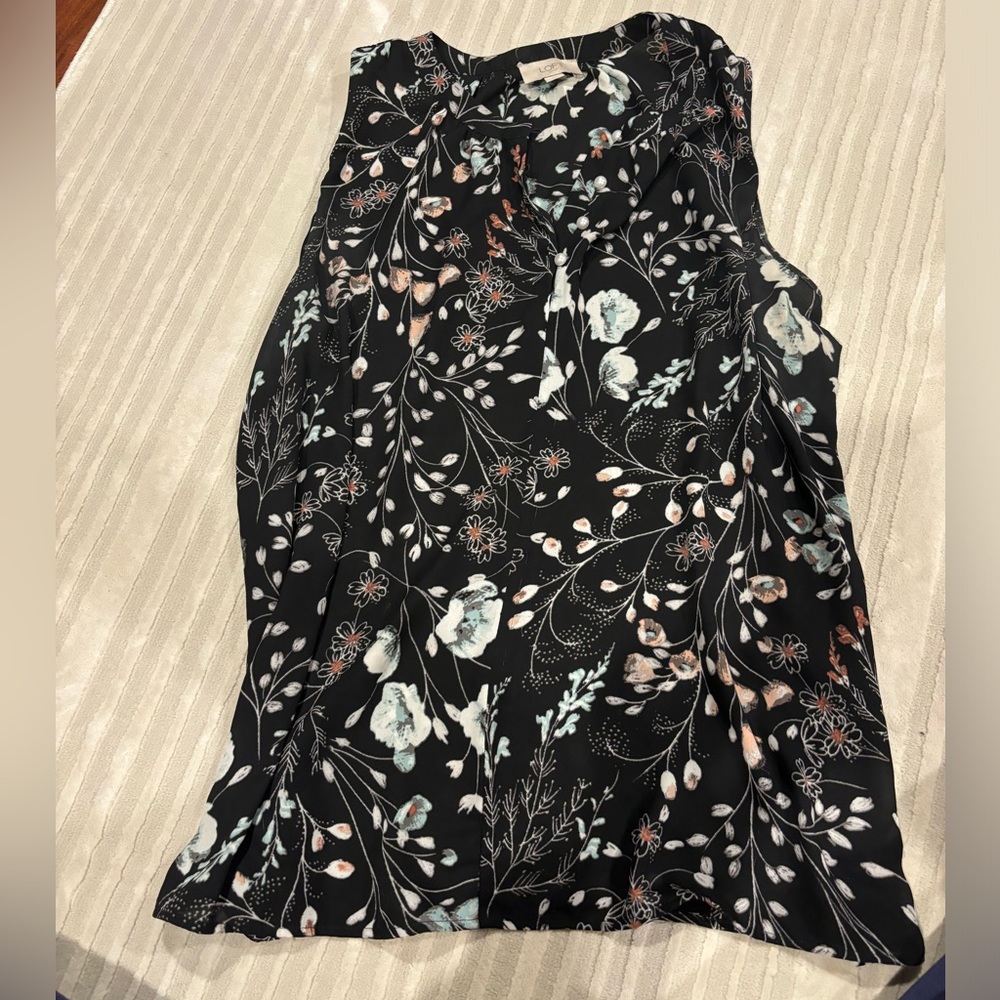 Black and floral print sleeveless blouse